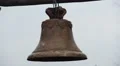 Antique rusty bronze bell ringing during church service, history museum exhibit HD Footage