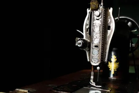 Antique sewing machine with copy space on table wood Stock Photos
