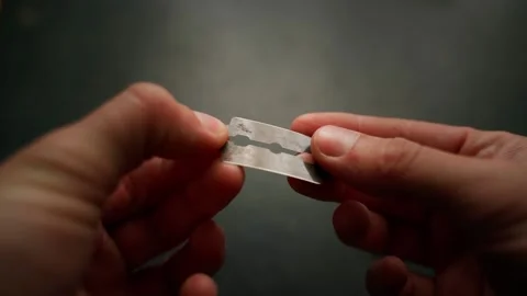 Antique sharp blade for fastening in a razor close-up in hands in a darkened 스톡 동영상 201300840