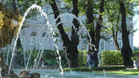 Antique statues on the paths of the Summer Garden on a sunny summer day. Stock Footage 340529798
