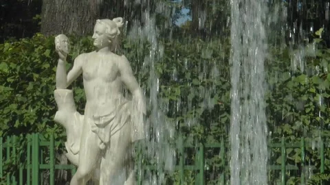 Antique statues on the paths of the Summer Garden on a sunny summer day. Video stock 340529816