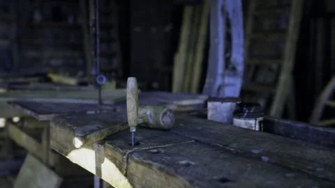 Antique style carpentry bench with tools and freshly cut wood particles Stock Footage 341826469
