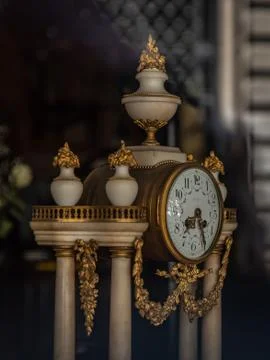 Antique table clock with marble and gold details Foto stock