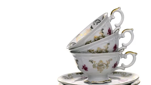Antique teacups spinning 360 degrees on pure white background with copy space Video stock 91152467