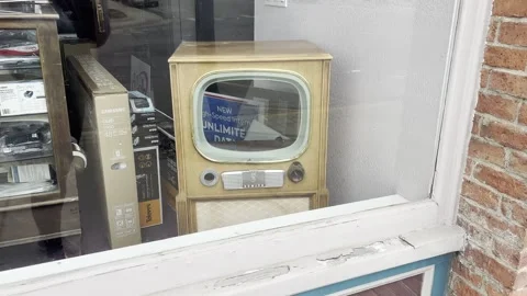 Antique television in a store front window. Stock Footage 342579375
