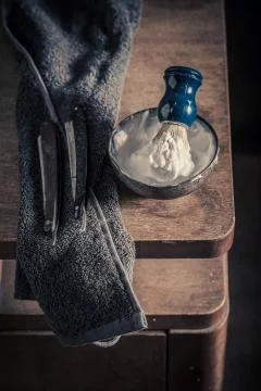 Antique tools for shave. Sharp razor, soap and brush Stock Photos
