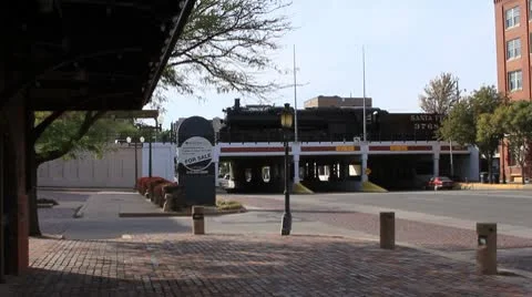 Antique train sits on active highway overpass Stock Footage 8914821