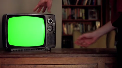 Antique TV Set Being Hit by Hand to Show Chroma Key Stock Footage 126870082