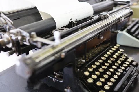 An antique typewriter in working condition prints text Stock Photos