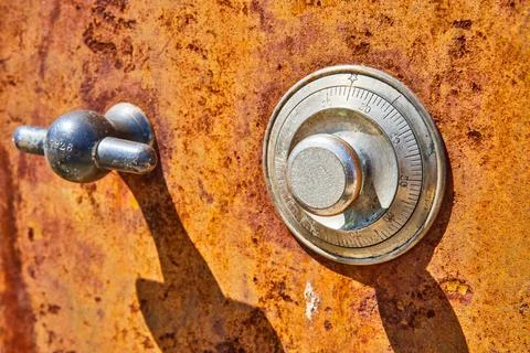 Antique, unique, dark orange rusting abstract car part, two silver shapes 스톡 사진