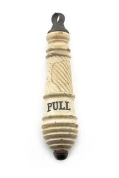 Antique vintage ceramic pull handle on white background Stock Photos