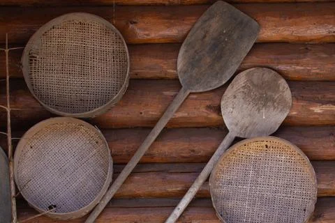 Antique, vintage items for making bread from wood. Sieve, shovel. Stock Photos