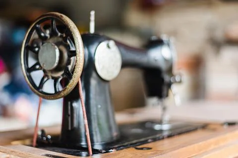 Antique vintage sewing machine Side view. Stock Photos