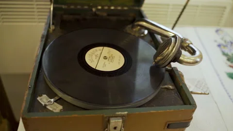 An antique vinyl record player standing on table. Stock Footage 231752095