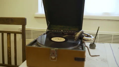 An antique vinyl record player standing on table. Stock Footage 231760501