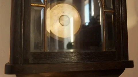 Antique wall clock with a pendulum closeup Stock Footage 71952902