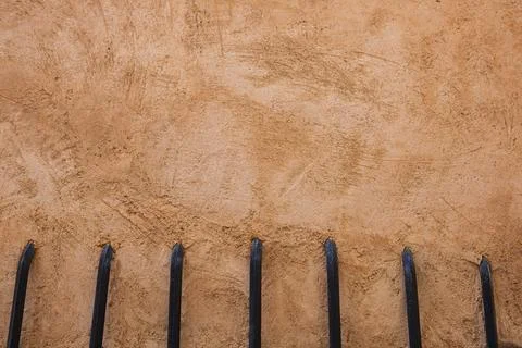 Antique wall texture with slightly orange and aged stripes and lined irons. Stock Photos