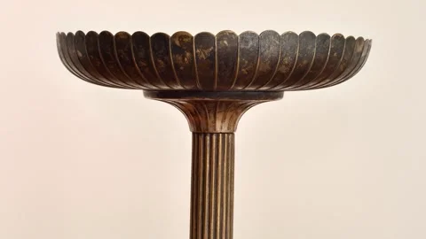 Antique weathered brass cake stand on the table Stock Footage 281829554