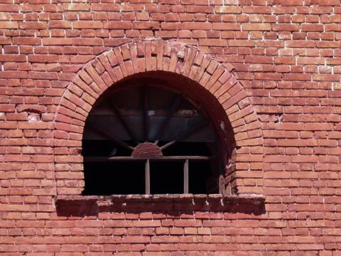 Antique window lined with red brick wall Foto stock
