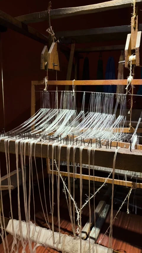 Antique Wooden Loom Threaded With White Yarn in Dim Interior Stock Footage 344456185