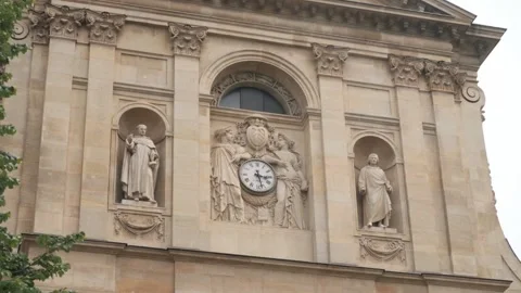 Antiques statues and clock on facade of Sorbonne University Stock Footage 151987915