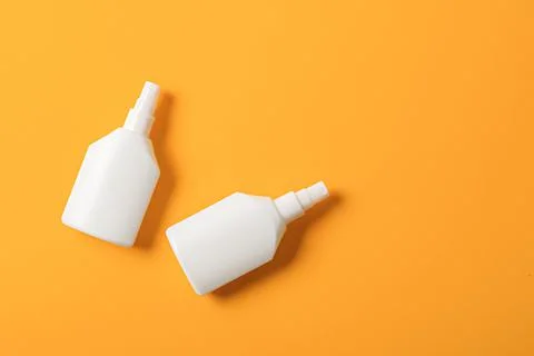 Antiseptic agents on an orange background with a copy of space. 库存照片