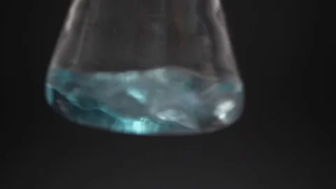 Antiseptic in a flask on a black background Stock Footage 128577294