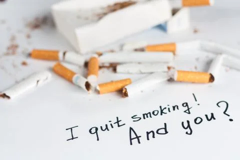 Antismoking background with broken cigarettes Stock Photos