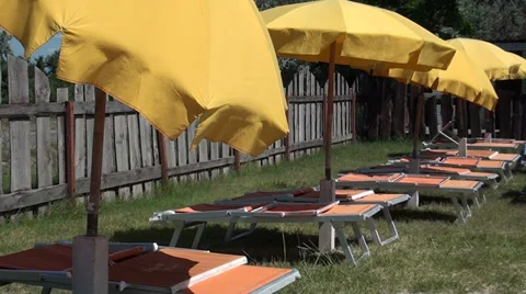 Antisun umbrellas on a beach Stock Footage 36521165