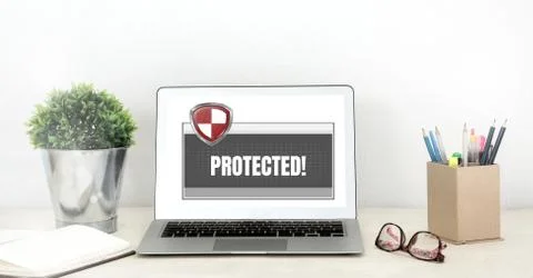 Antivirus security protection shield software on laptop Stock Photos