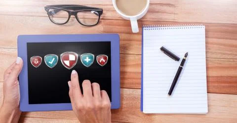 Antivirus security protection shield on tablet Stock Photos