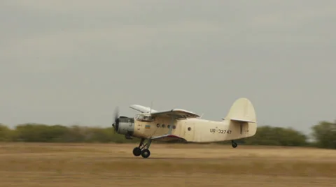 Antonov An-2R taking off from airfield Stock Footage 38573271