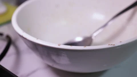 Ants infesting dirty bowl in messy kitchen Stock Footage 344059618