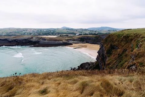 Antuerta Beach. Beach surrounded by cliffs and very popular for surfers Foto stock