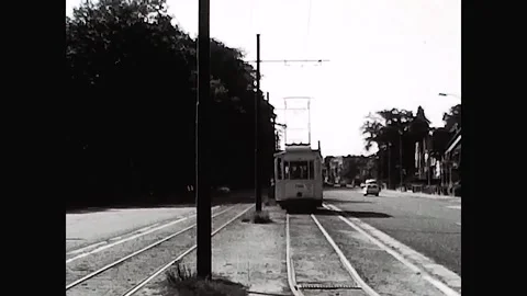 Antwerp, Belgium, 1967 - Tram pulls away along the city boulevard Vidéo 167797161