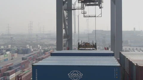 Antwerp harbour drone shot of a container being loaded onto a ship Stock Footage 249226718
