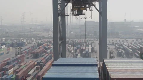 Antwerp harbour evergreen container loaded onto ship drone shot Stock Footage 249192218