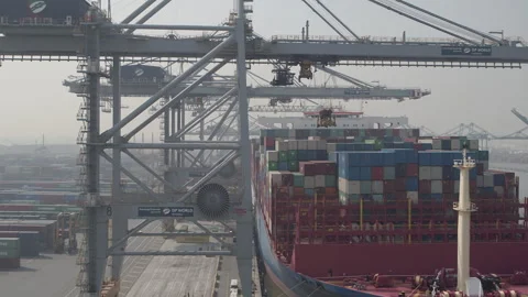 Antwerp harbour loading and shipping containers onto a ship drone shot Stock Footage 249175818