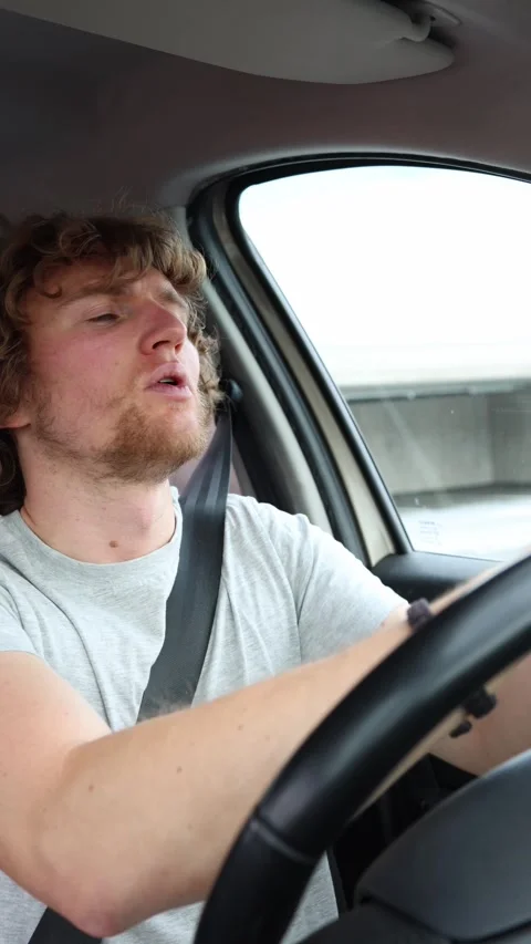 Anxious beginner driver carefully navigates traffic during a first journey Stock Footage 342919685
