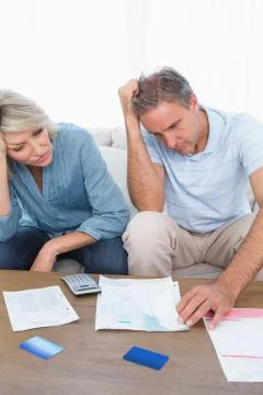 Anxious couple going over bills Fotos Stock