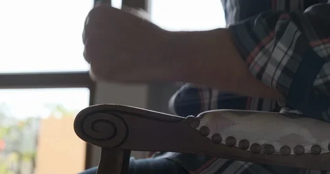 Anxious, impatient man sitting down in a chair and pounding on the chair arm. Stock Footage 116892152
