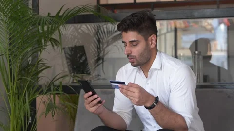 Anxious  Indian young man having problem in online transaction Stock-Footage 146301246