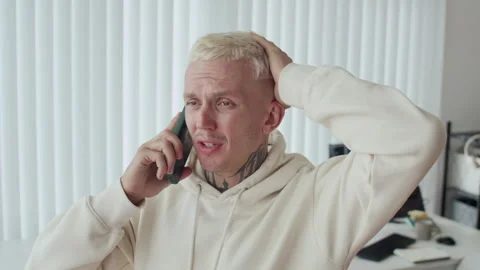 Anxious Male Developer Calling on Smartphone at Office Stock Footage 303559016