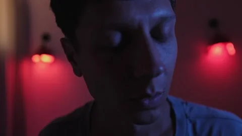 Anxious man looking down and suddenly turning toward a possible threat Stockbeeldmateriaal 347299495