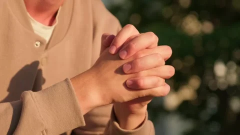 Anxious man with a nervous hand gesture. Close up of a man sitting outdoors.. Stock Footage 339547392