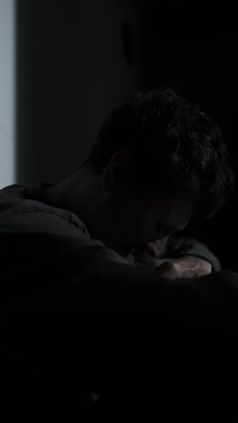 Anxious man whispering to himself in the dark, racing thoughts and mental Stock Footage 321729657