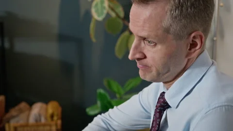 Anxious Middle-aged Man Fidgeting and Talking in Therapy Session Stock Footage 340626253