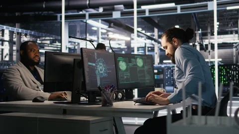 Anxious technicians in data center reacting to system lockdown caused by hacker Stock Footage 309640380