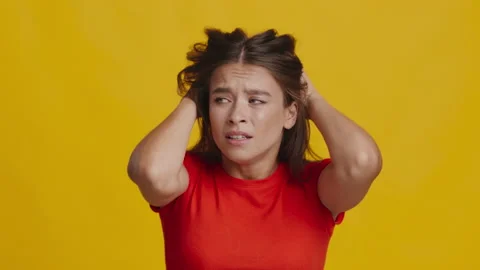 Anxious Woman Having Panic Attack Expressing Fear On Yellow Background Stock Footage 160821949