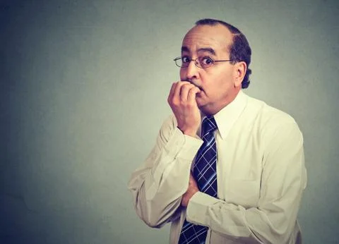 Anxious worker biting nails Stock Photos